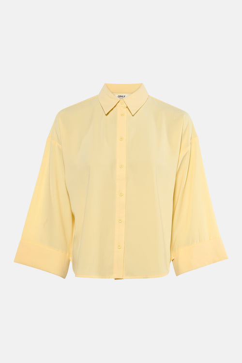 Chemisier jaune à manches longues de ONLY, coupe ample avec fermeture boutonnée centrée.