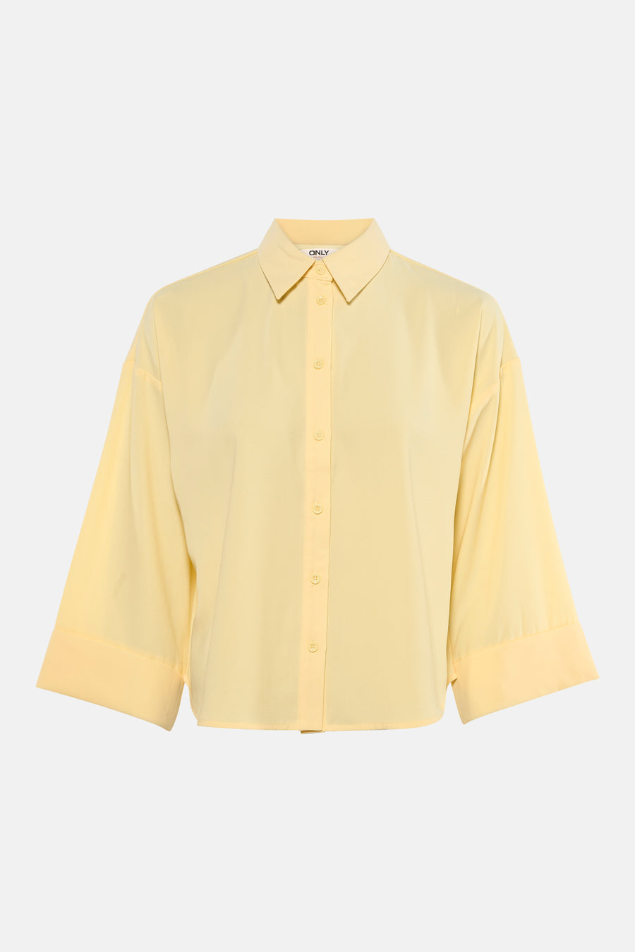Chemisier jaune à manches longues de ONLY, coupe ample avec fermeture boutonnée centrée.