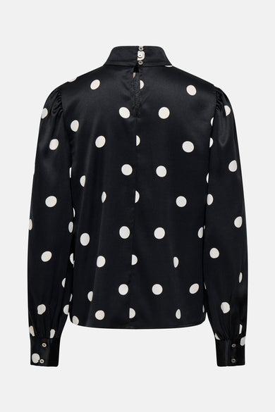 Blouse noire à manches longues de ONLY, à pois blancs et fermeture boutonnée au dos.