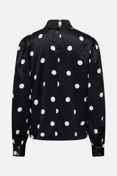 Blouse noire à manches longues de ONLY, à pois blancs et fermeture boutonnée au dos.