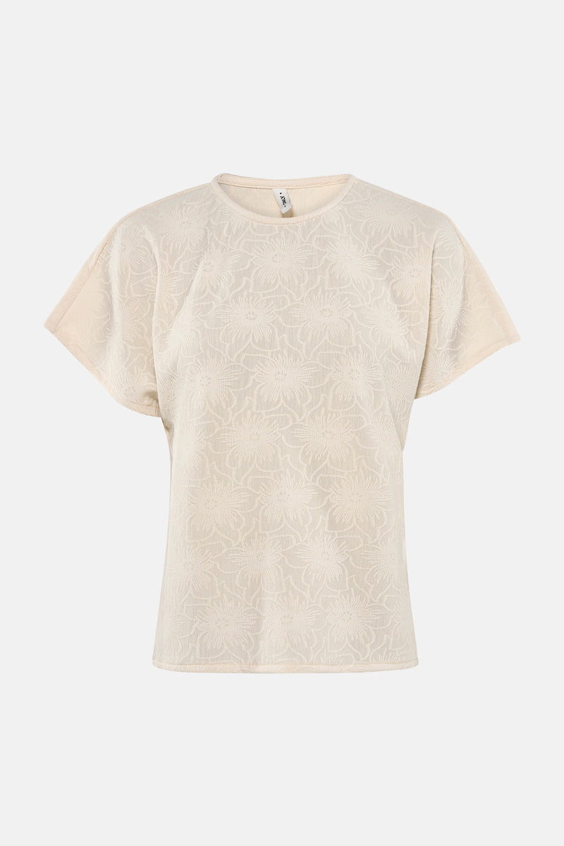 T-shirt beige à manches courtes par ONLY®, avec un motif floral texturé sur toute la surface.