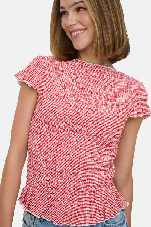 T-shirt rouge à carreaux en smocks de ONLY, avec manches courtes à volants.