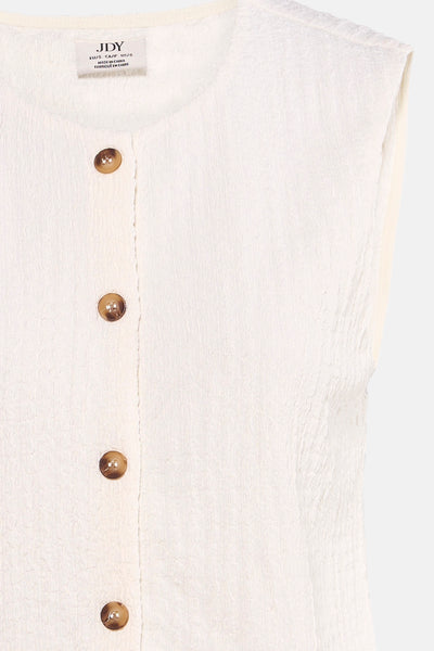 White sleeveless top with textured fabric and brown buttons by JDY, close-up front view