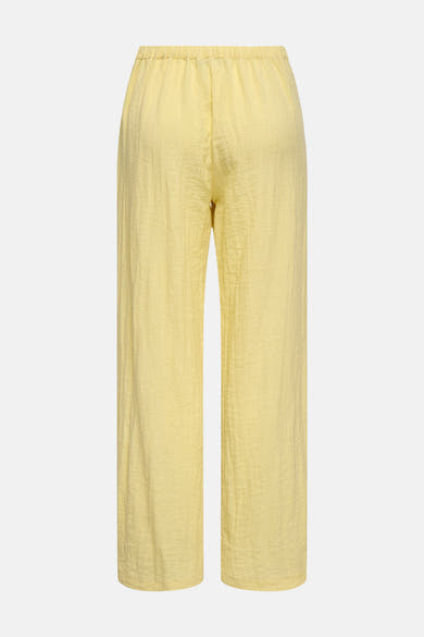 Wijd geel kostuumbroek van ONLY® met elastische tailleband en crêpe-textuur, achterzijde.