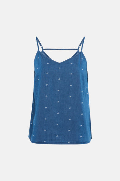 Débardeur bleu denim moyen de ONLY® avec col en V, fines bretelles, motif nœuds blancs et bride au dos.