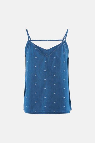 Débardeur en jean bleu moyen de ONLY® à motif de petits nœuds papillon blancs, avec fines bretelles et col en V.