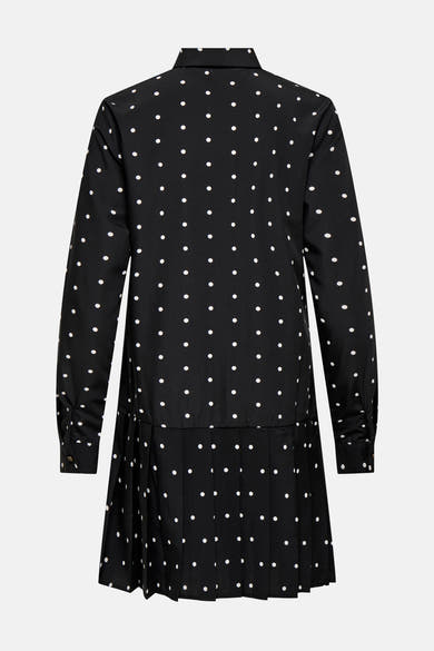 Robe noire à manches longues par ONLY®, à pois blancs et jupe plissée.
