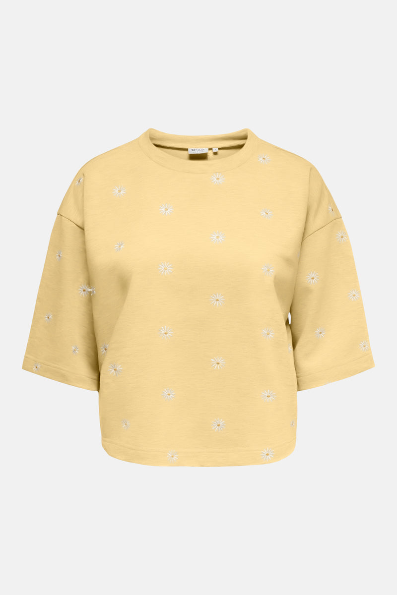 Gele rondehals sweatshirt van ONLY® met geborduurd patroon van witte madeliefjes, achterzijde.