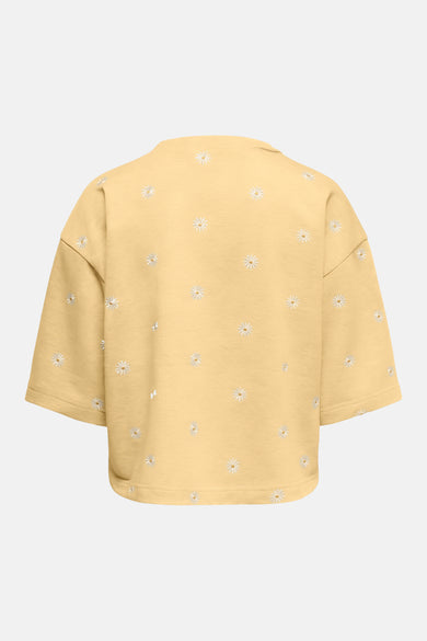 Sweat jaune col rond par ONLY® avec motif brodé de marguerites blanches, vue de dos.
