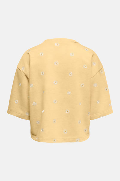 Sweat jaune col rond par ONLY® avec motif brodé de marguerites blanches, vue de dos.
