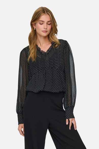 Chemisier à manches longues noir par ONLY®, à pois blancs et manches transparentes.