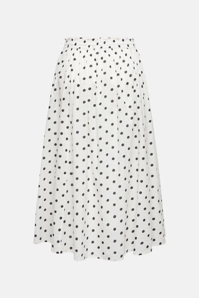 Jupe longue blanche à pois noirs de JDY, avec taille élastique et coupe évasée.
