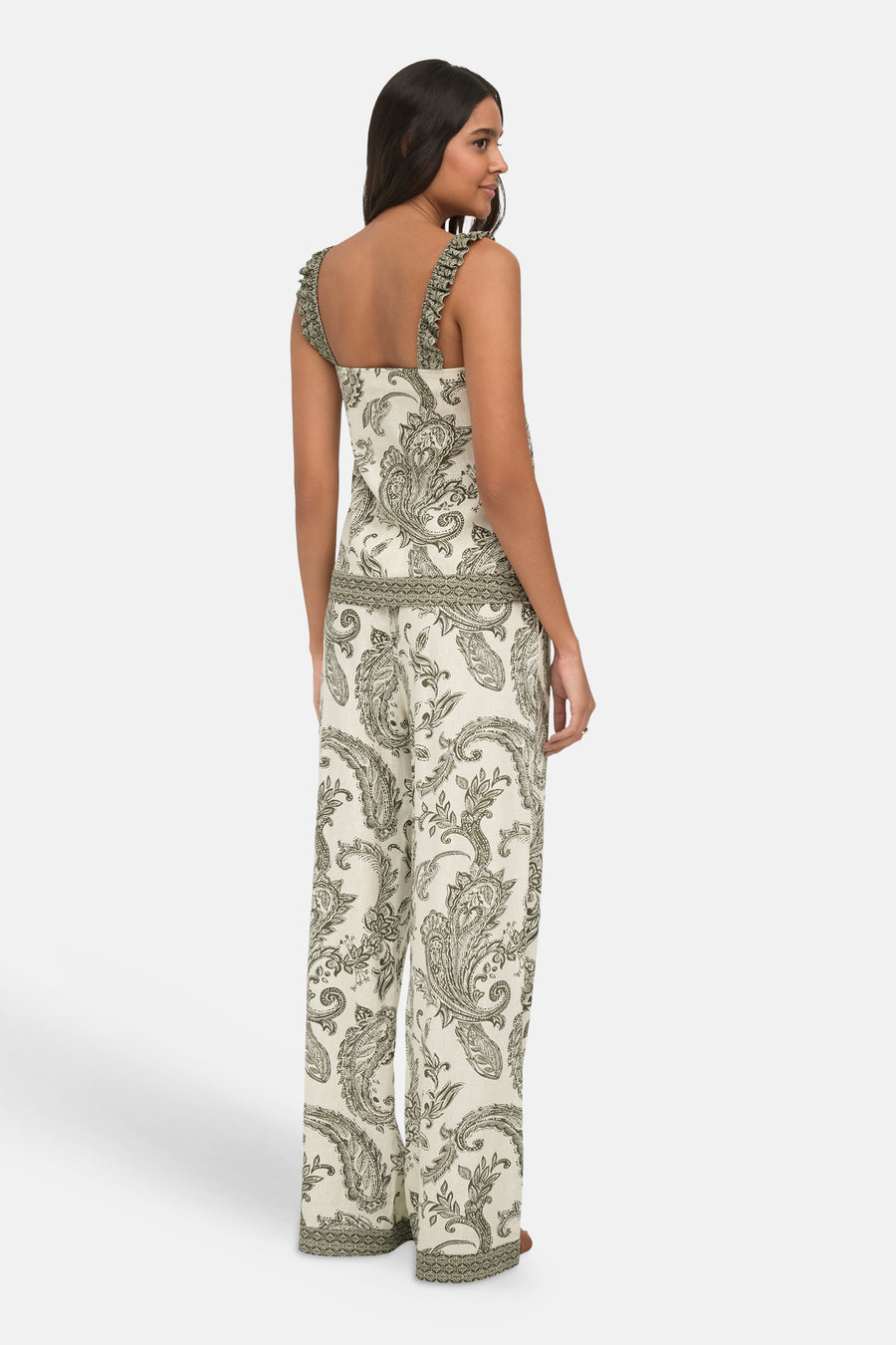Ivy green sleeveless blouse with floral paisley print and ruffled straps, back view showing open back design and matching wide-leg pants.