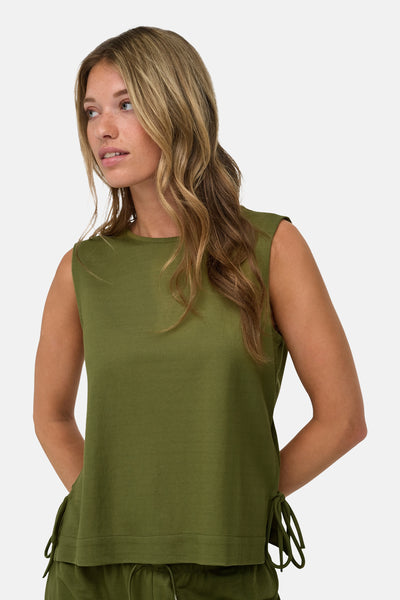 Olive green sleeveless blouse with side ties, shown on model in front view, textured fabric, relaxed fit