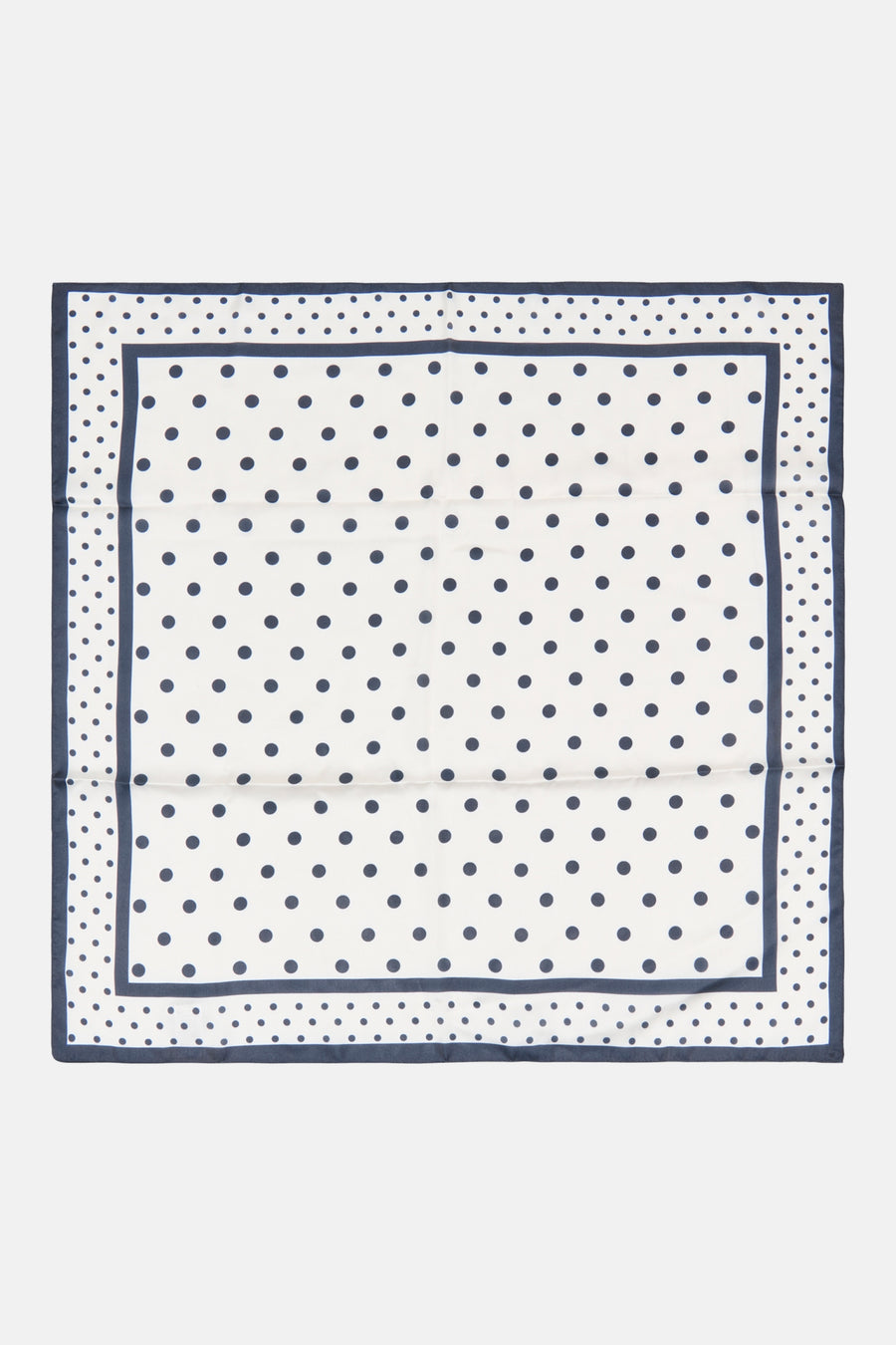 White silk foulard with navy polka dots and border, flat lay view