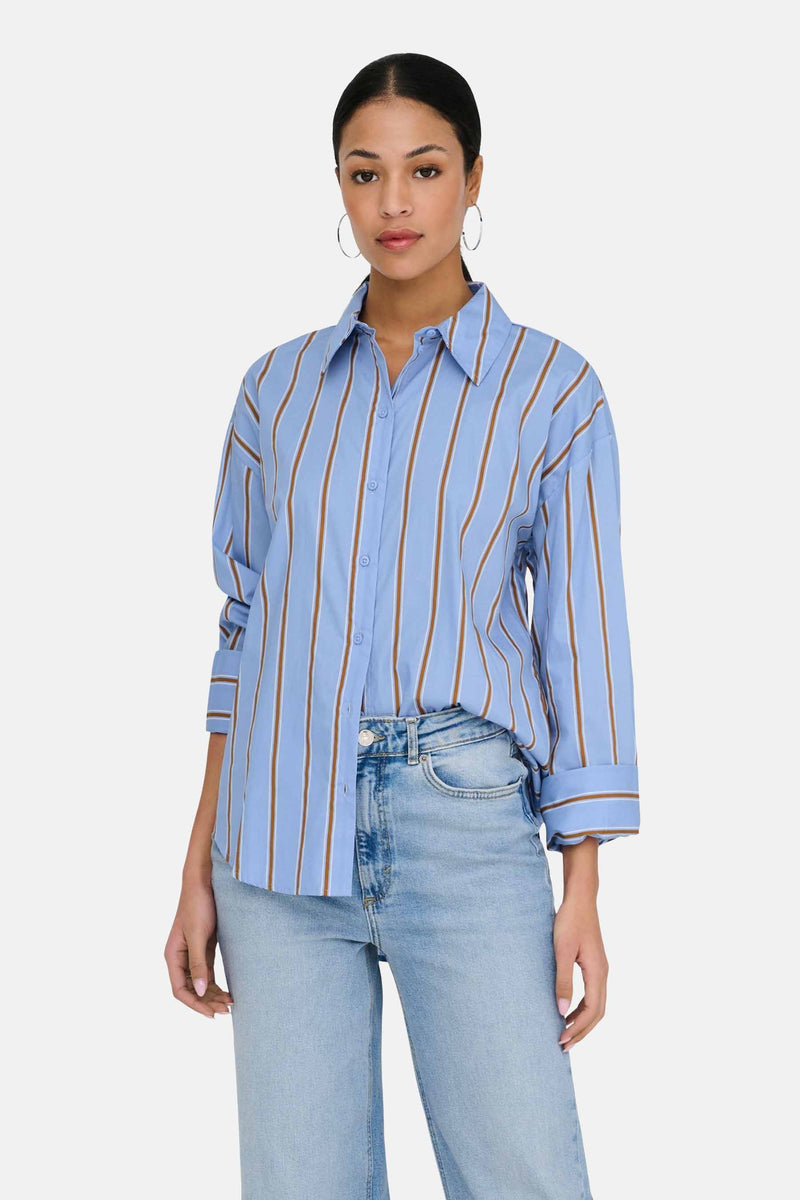 Light blue long-sleeve striped chemise with brown vertical stripes, button-down front, and cuffed sleeves, worn with light wash jeans in a lifestyle front view.