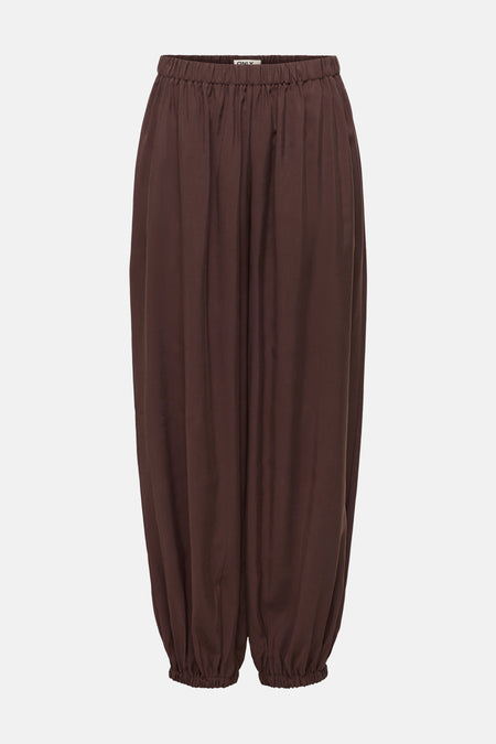 Pantalon ample brun par ONLY, avec une taille élastiquée et des chevilles resserrées.
