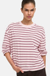 Pale lilac long-sleeve t-shirt with burgundy horizontal stripes, relaxed fit, rolled sleeves, round neckline, front view on model