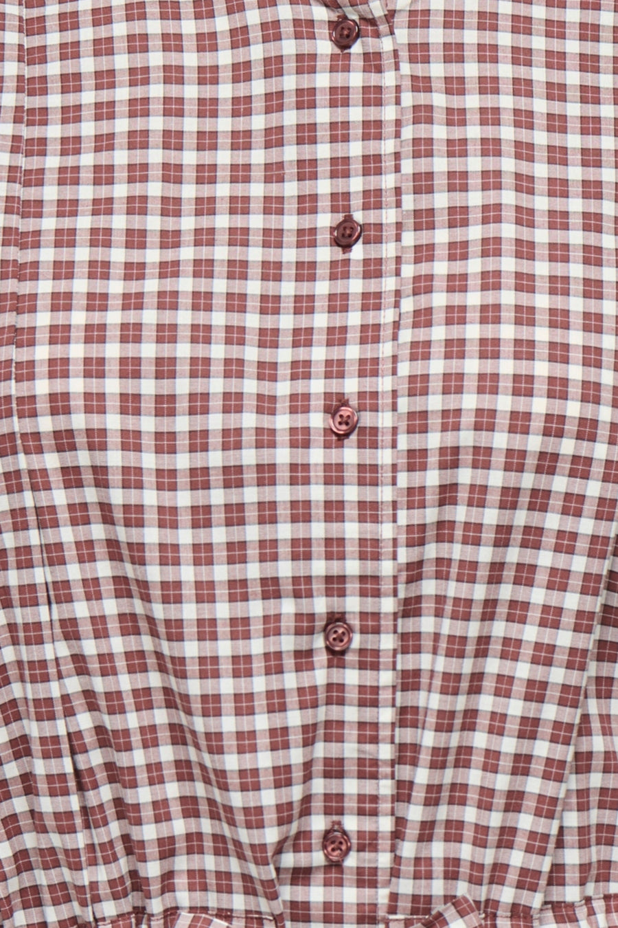 Cappuccino long-sleeve blouse with red and white gingham check pattern, featuring matching buttons and front placket, close-up view