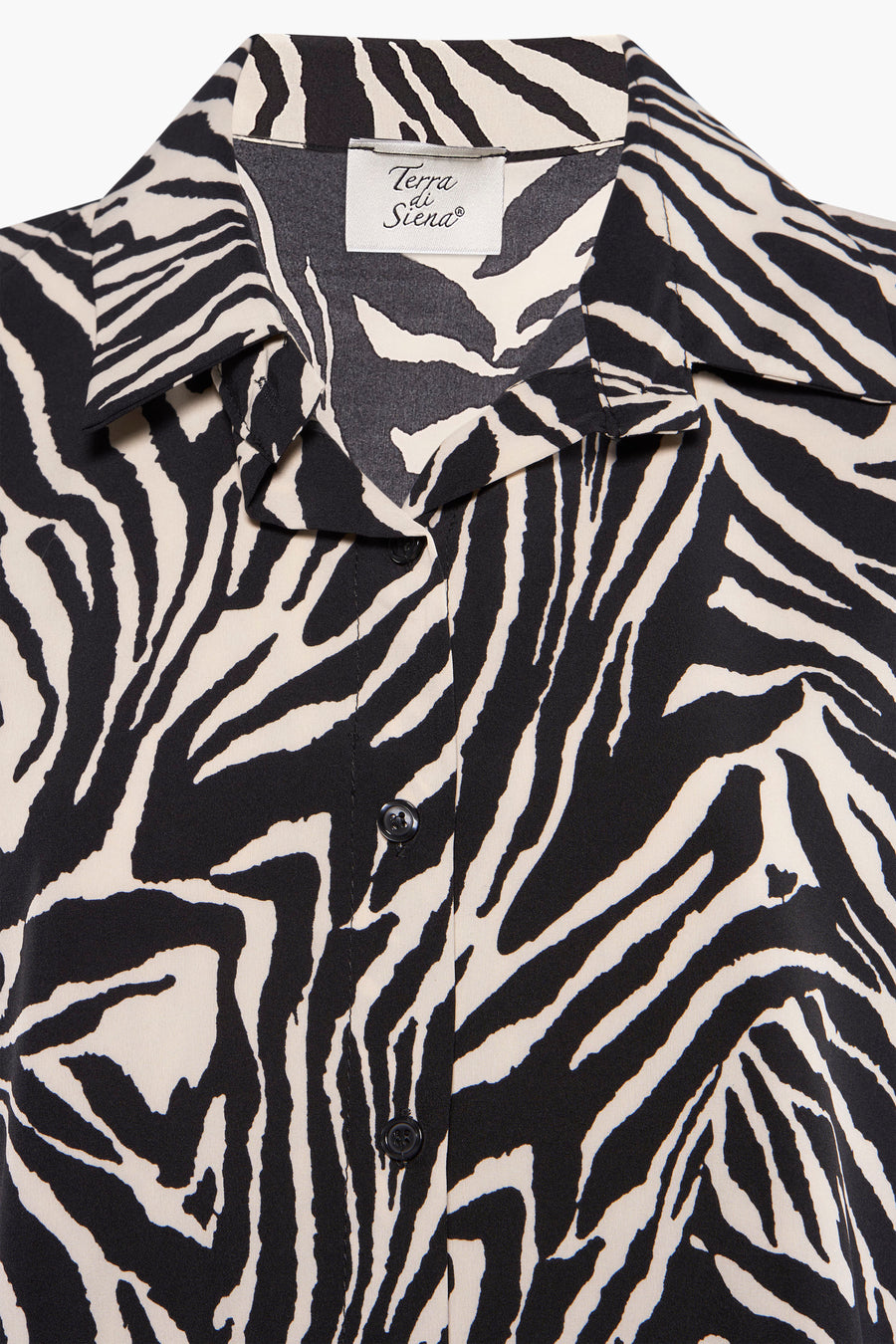 Multikleurige jurk met lange mouwen van Terra di Siena, zwart-beige zebraprint, overhemdkraag en knopen.