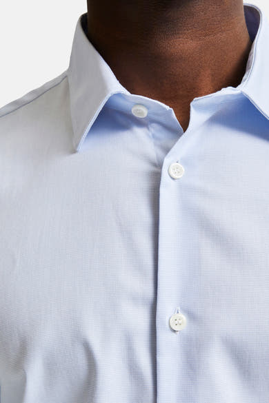 Blauw overhemd met lange mouwen van SELECTED, kraag- en knoopsluiting detail.