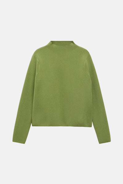 Groene trui met ronde hals van MANGO, met een zachte textuur en lange mouwen, gepresenteerd op een effen achtergrond.