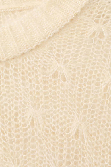 Pull à col rond beige de MANGO, en maille ajourée à motif géométrique, texture duveteuse.