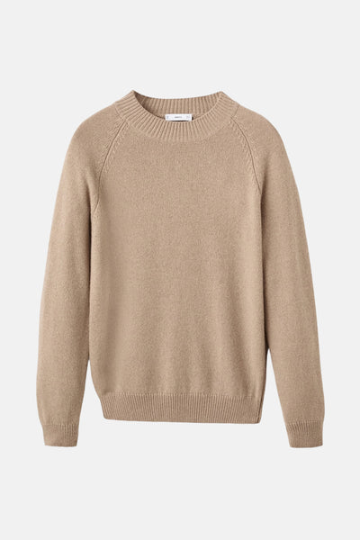 Pull à col rond beige de MANGO, en tricot uni avec manches longues raglan et ourlet côtelé.

