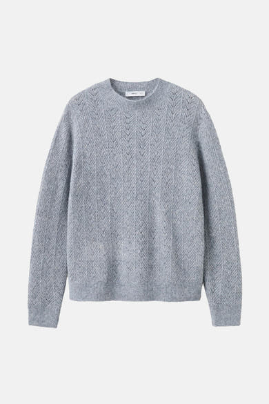 Pull bleu à col rond par MANGO, avec motif ajouré vertical en chevrons.