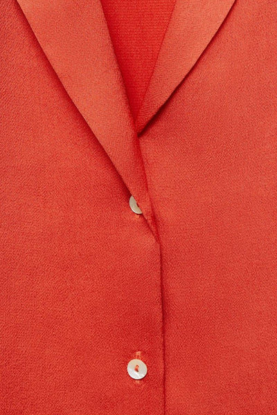 Oranje blouse met korte mouwen van MANGO, textuurdetail met kraag en knopen.