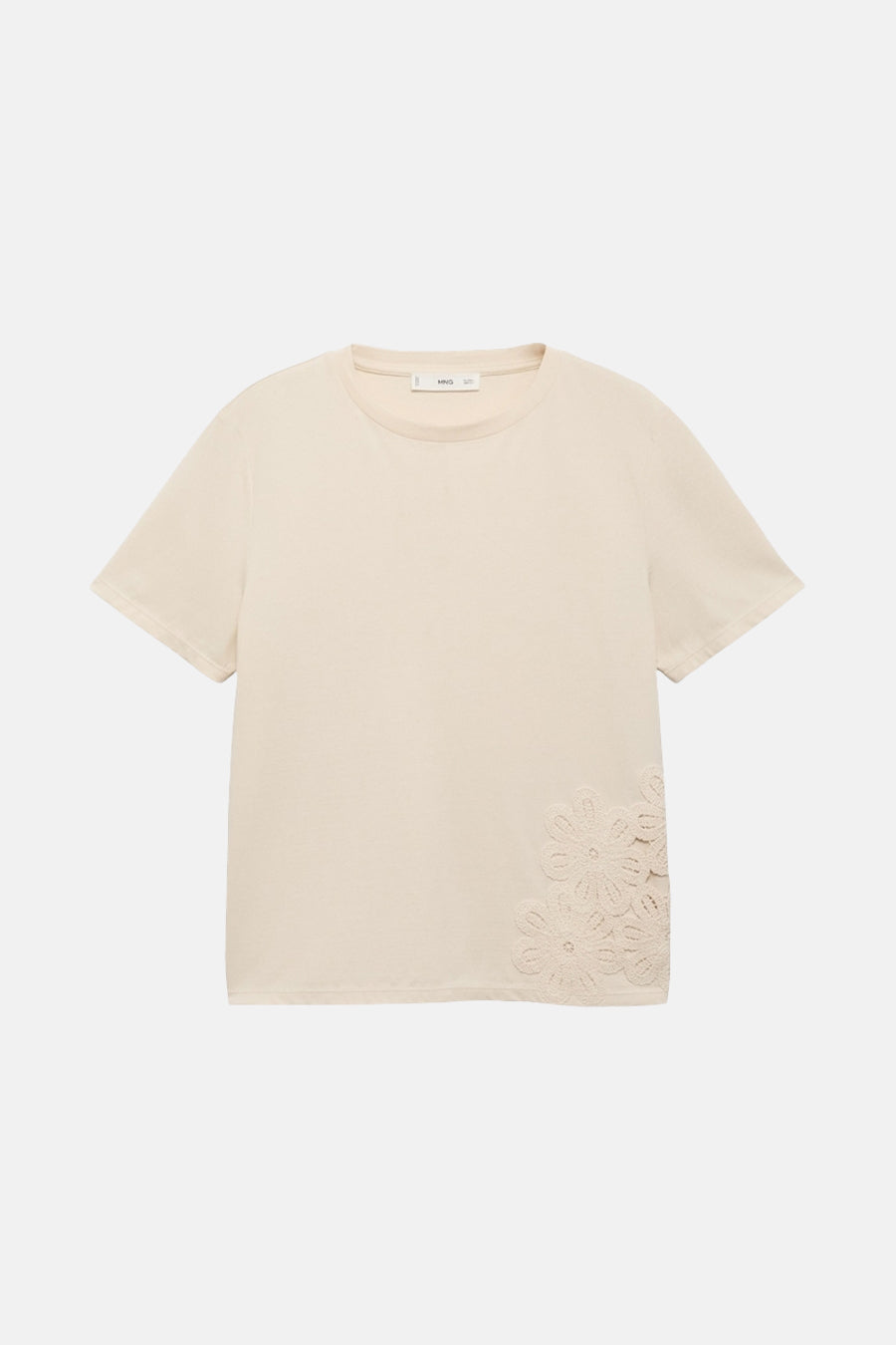 T-shirt beige à manches courtes de MANGO, avec des motifs floraux décoratifs sur le côté.
