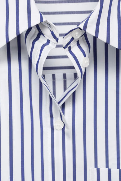Chemise multicolore à rayures by MANGO avec col boutonné et fermeture boutonnée.