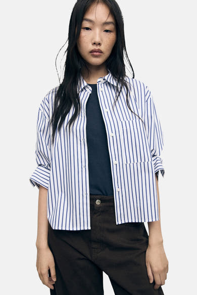 Multikleuren gestreept overhemd van MANGO met een button-down kraag en knoopsluiting.