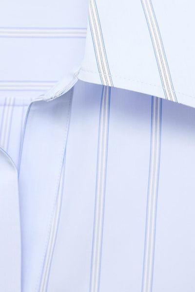 Blauwe gestreepte blouse met lange mouwen van MANGO, kraagdetail zichtbaar.