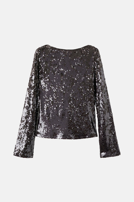 Bruine blouse met lange mouwen van MANGO, bedekt met glinsterende pailletten, gedragen met zwarte puntige pumps.