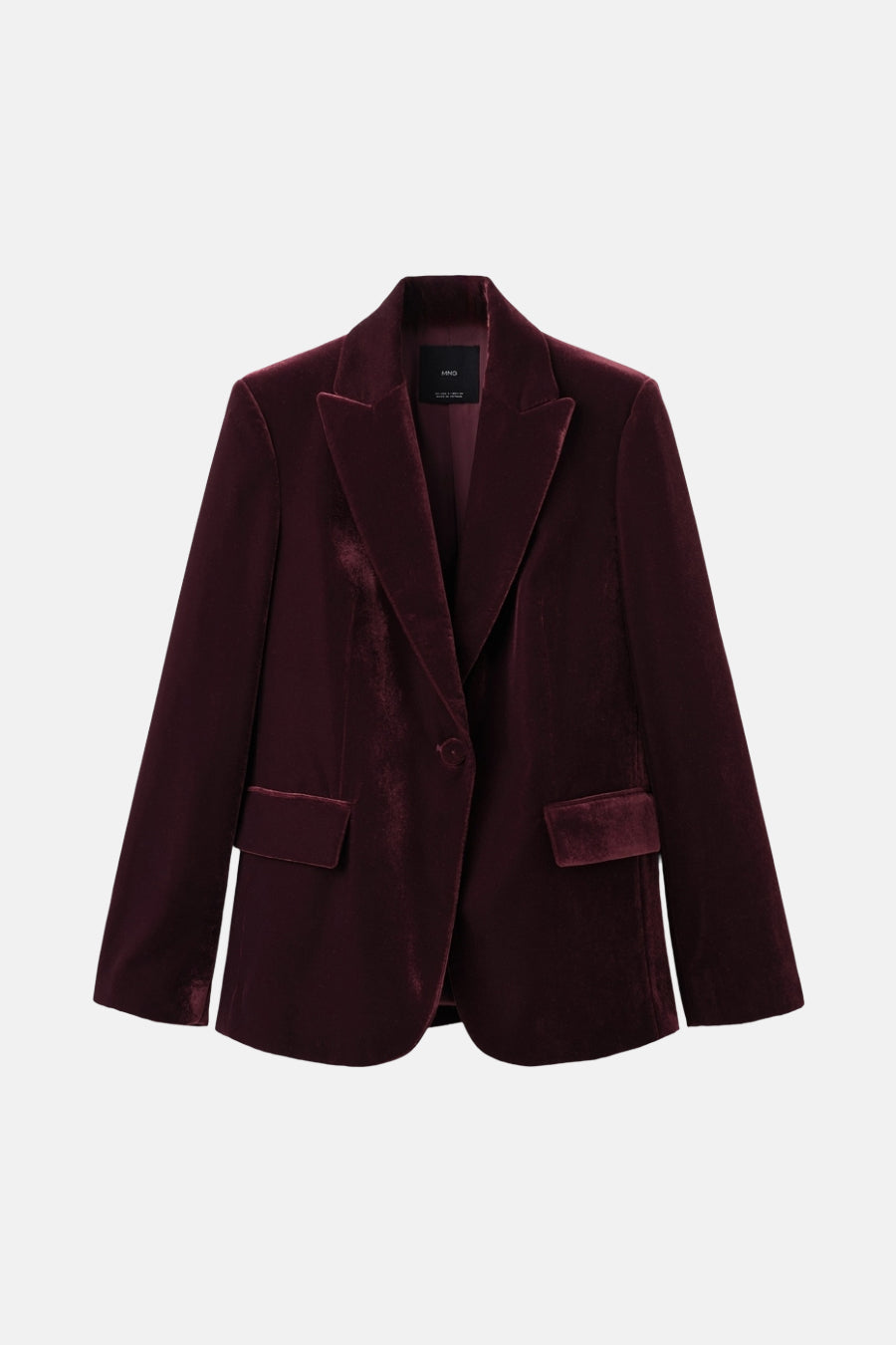 Blazer bordeaux en velours de MANGO, avec un col à revers et des poches passepoilées.