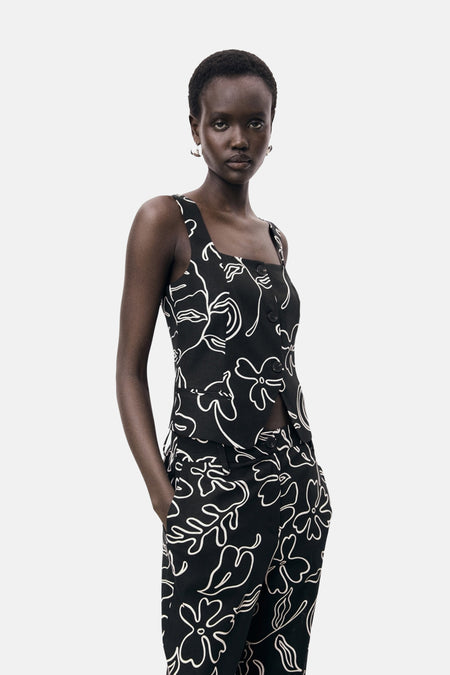 Zwart mouwloos overhemd van MANGO, met witte bloemenprint en aansluitende pasvorm.