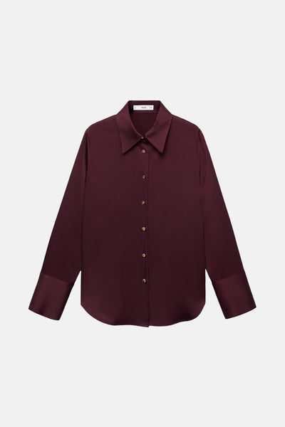 Chemise bordeaux à manches longues de MANGO, avec fermeture boutonnée dorée et poignets droits.
