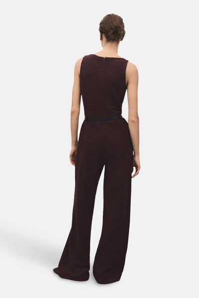 Bordeaux gebreid jumpsuit van MANGO, met zwarte tailleband en wijde pijpen.