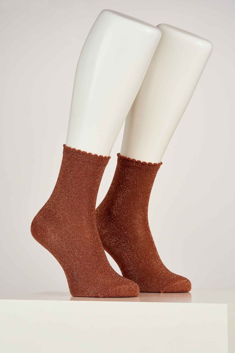 Brown shimmer ankle socks with scalloped ribbed cuff, displayed on mannequin legs in side view