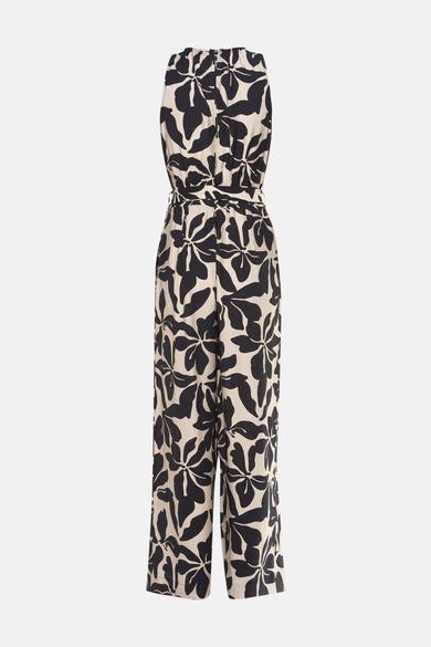Zwarte jumpsuit met bloemenprint van MANGO, met strikceintuur in de taille en wijde pijpen.