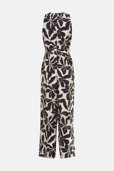 Zwarte jumpsuit met bloemenprint van MANGO, met strikceintuur in de taille en wijde pijpen.