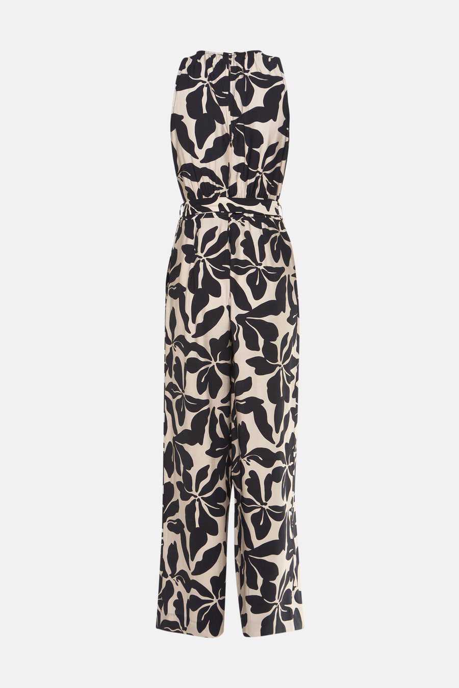 Combinaison noire à fleurs de MANGO, avec ceinture à nouer à la taille et jambes larges.