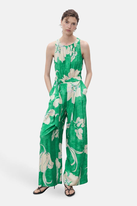 Groen jumpsuit met bloemenprint van MANGO, met strikceintuur en wijde pijpen.
