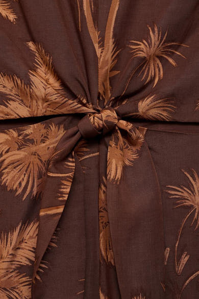 Bruin MANGO jumpsuit met palmboomprint en decoratieve strik in de taille.