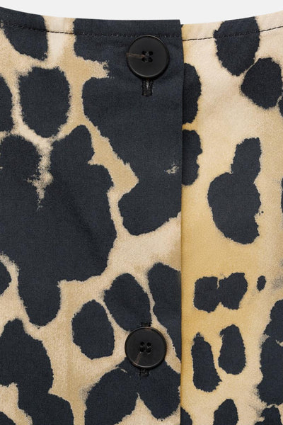 Beige mouwloos bloesje van MANGO, met zwart en fauve dierenprint, met knopen.