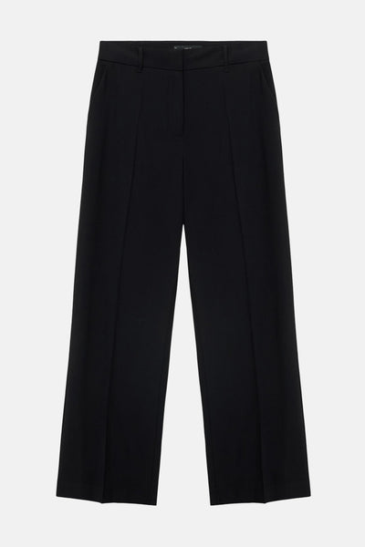 Pantalon noir par MANGO, coupe ample avec plis sur le devant.
