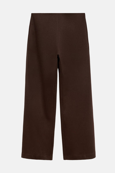 Pantalon marron by MANGO, coupe ample et tissu lisse, présenté sur un fond neutre.