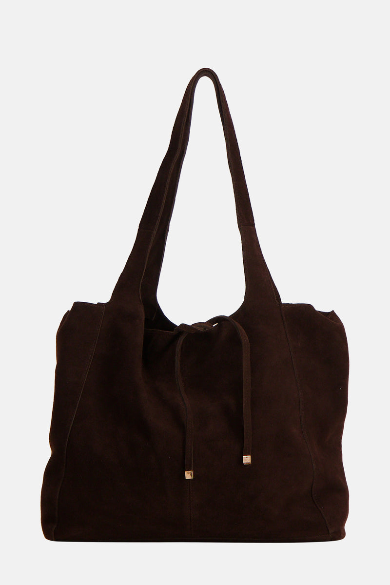 Sac à main brun de MANGO, en suède avec des cordons de serrage décoratifs et des anses souples.
