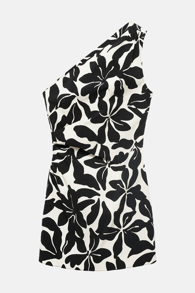 Zwarte asymmetrische jurk van MANGO, met een contrasterende bloemenprint, een nauwsluitende pasvorm en een gladde textuur.